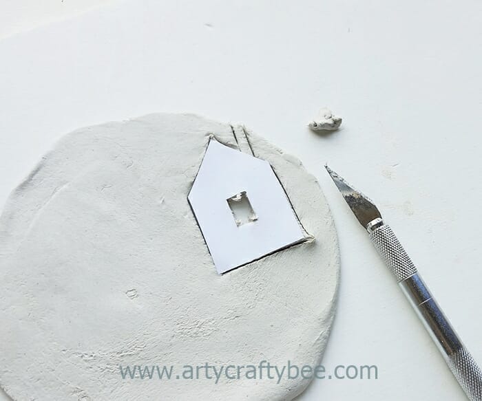 place the house template on the clay dough